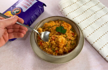 arroz meloso con pollo servir